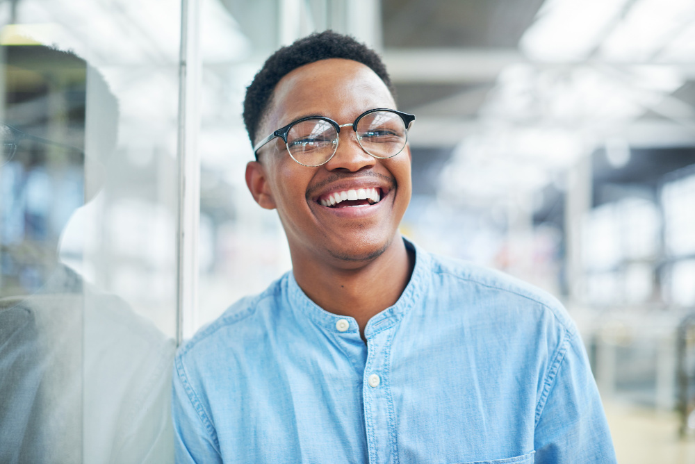 Person in blue shirt smiling